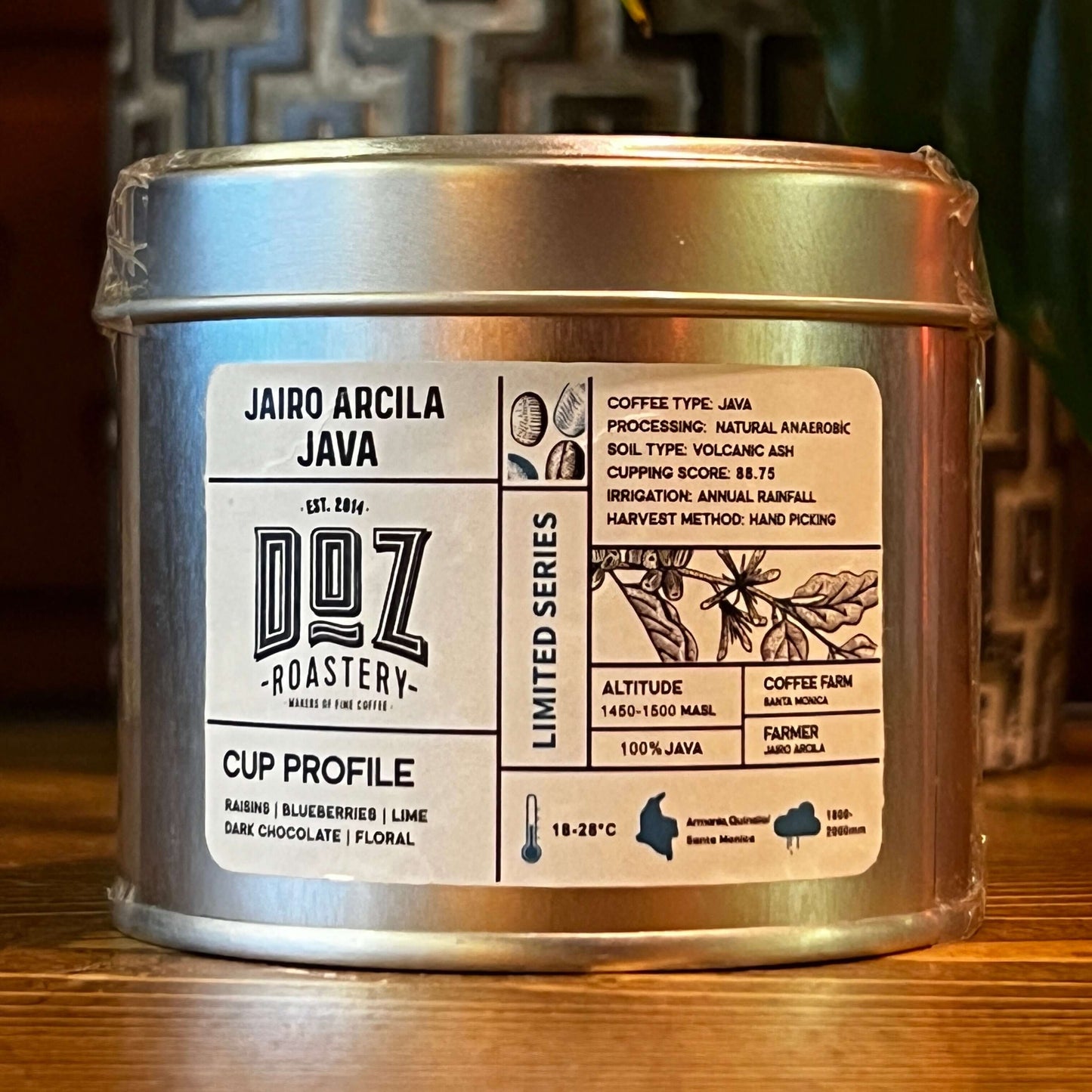 Jairo Arcila Java coffee tin with cup profile details and roastery logo, showcasing specialty coffee attributes.