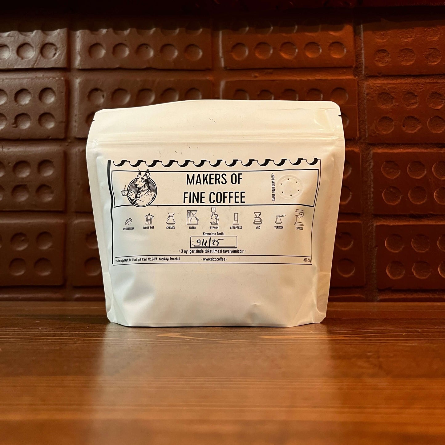 Package of Costa Rica Don Sabino MicroMill coffee beans on a wooden table.